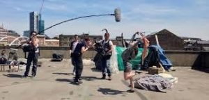 People Working Behind the Scenes on a Film Set